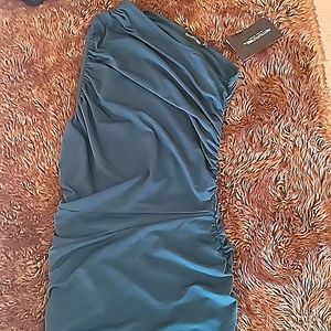 Green one shoulder dress.